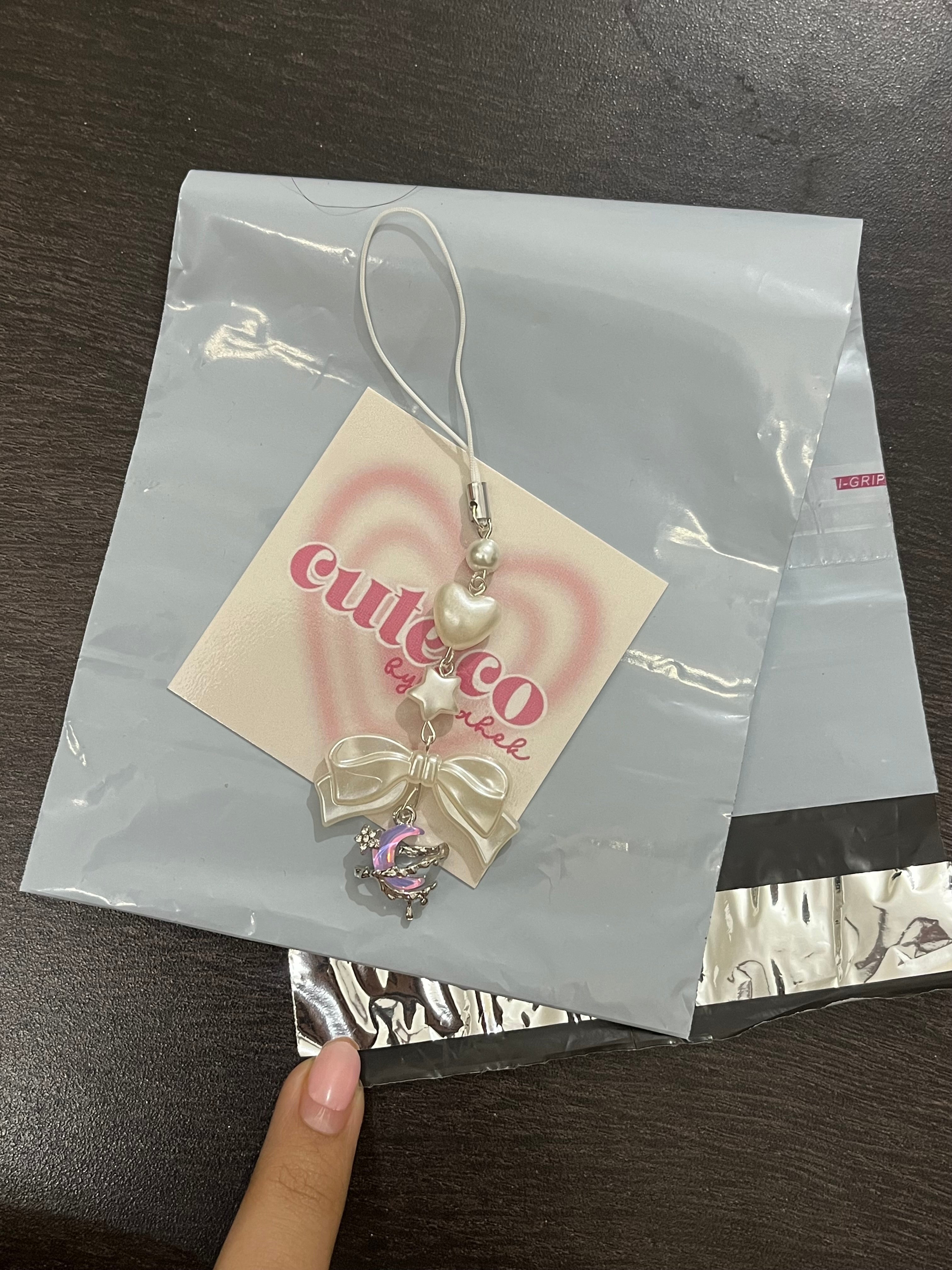 pink drippy moon phone charm