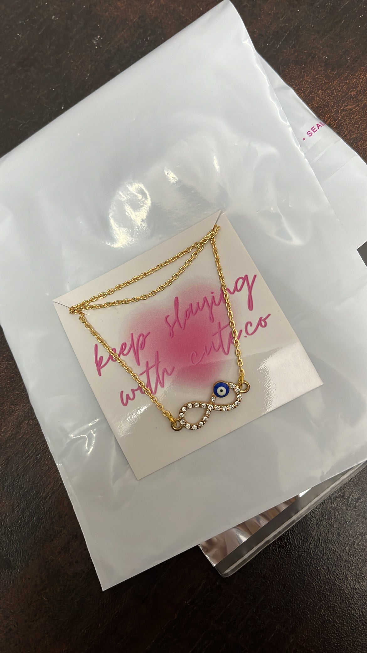 golden infinity with evil eye chain