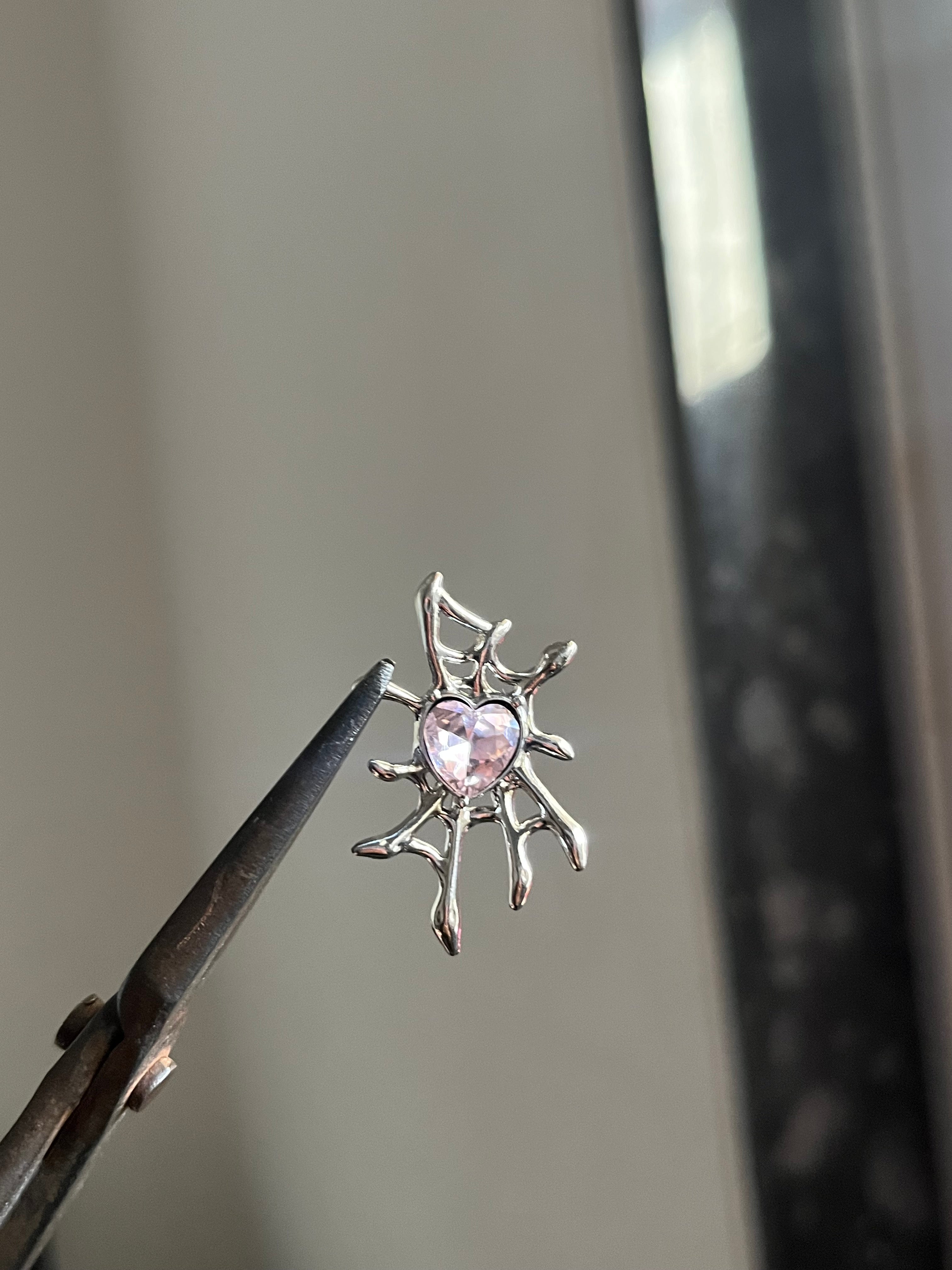 pink spider web charm