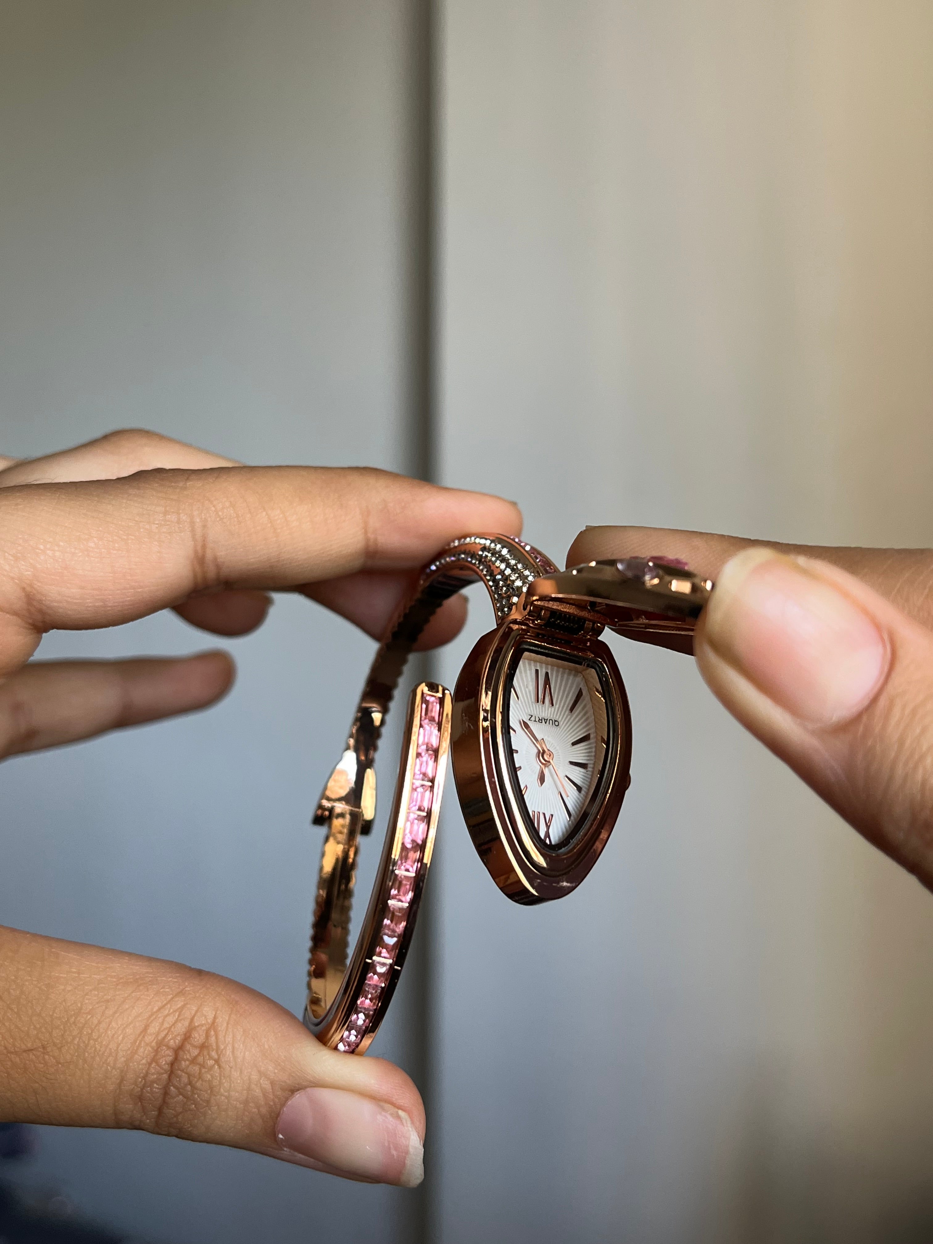 pink openable snake watch