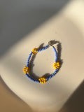 blue beaded daisy bracelet