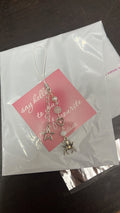 white spider phone charm