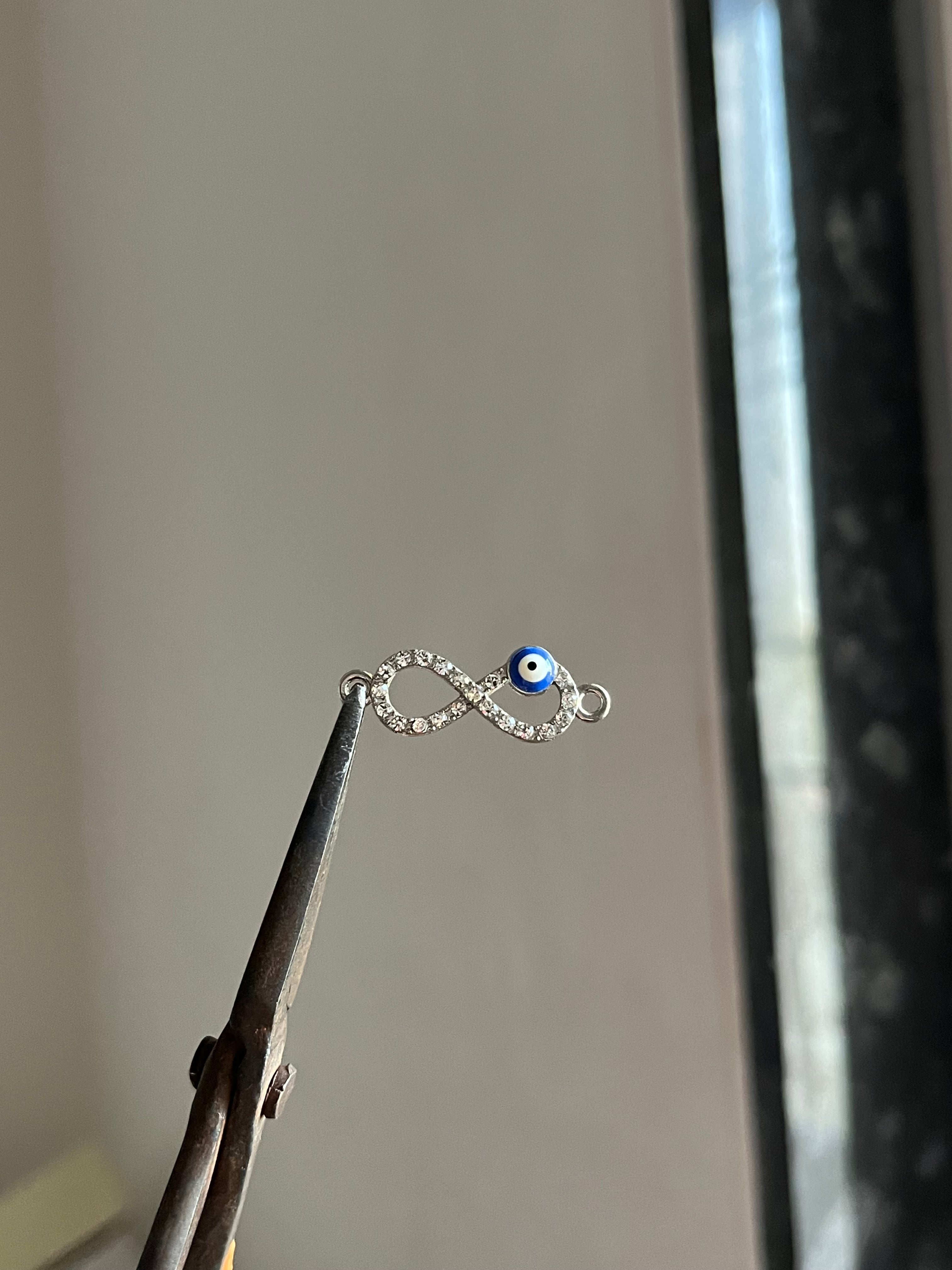 silver evil eye infinity charm