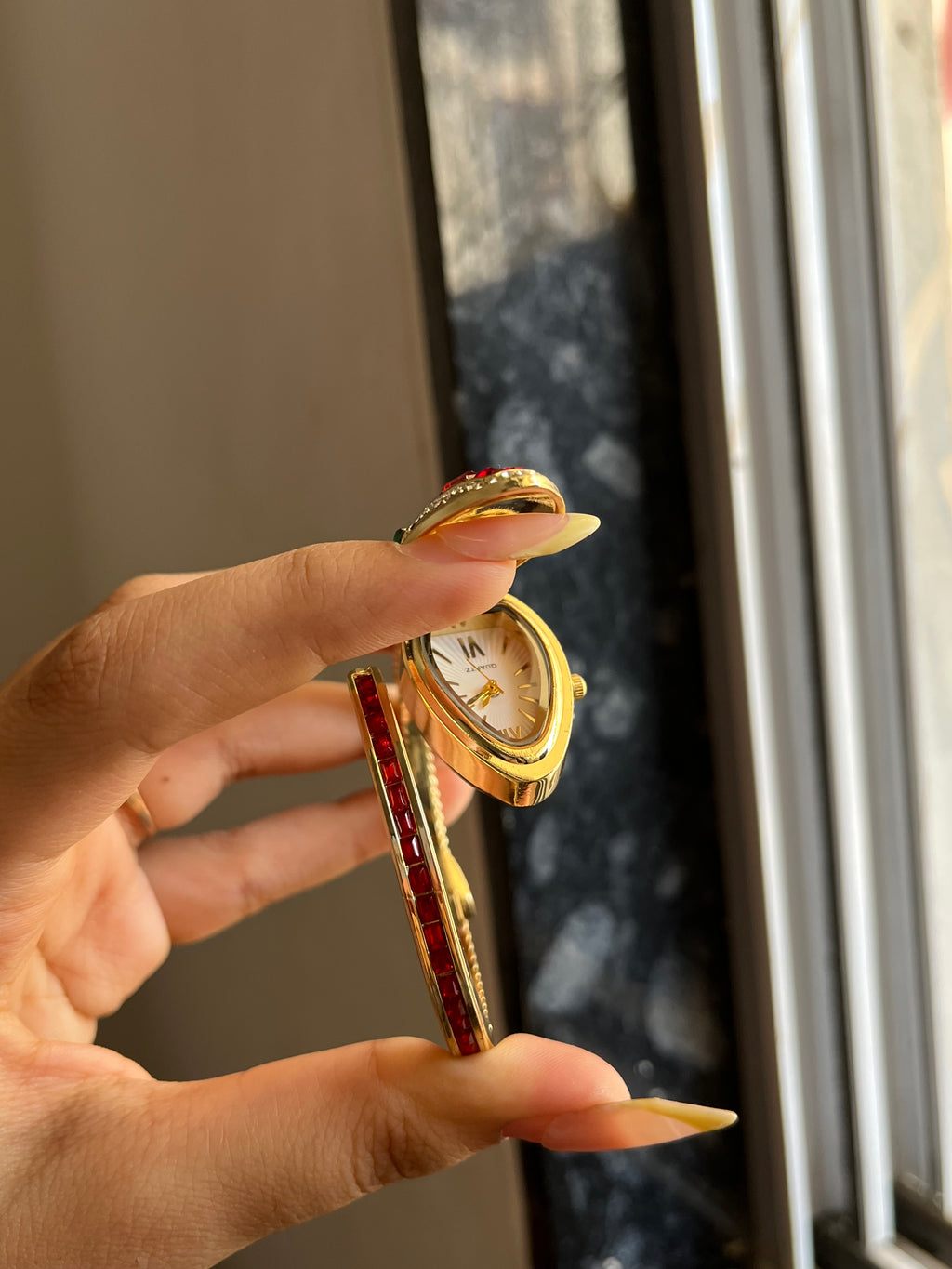 red openable snake watch