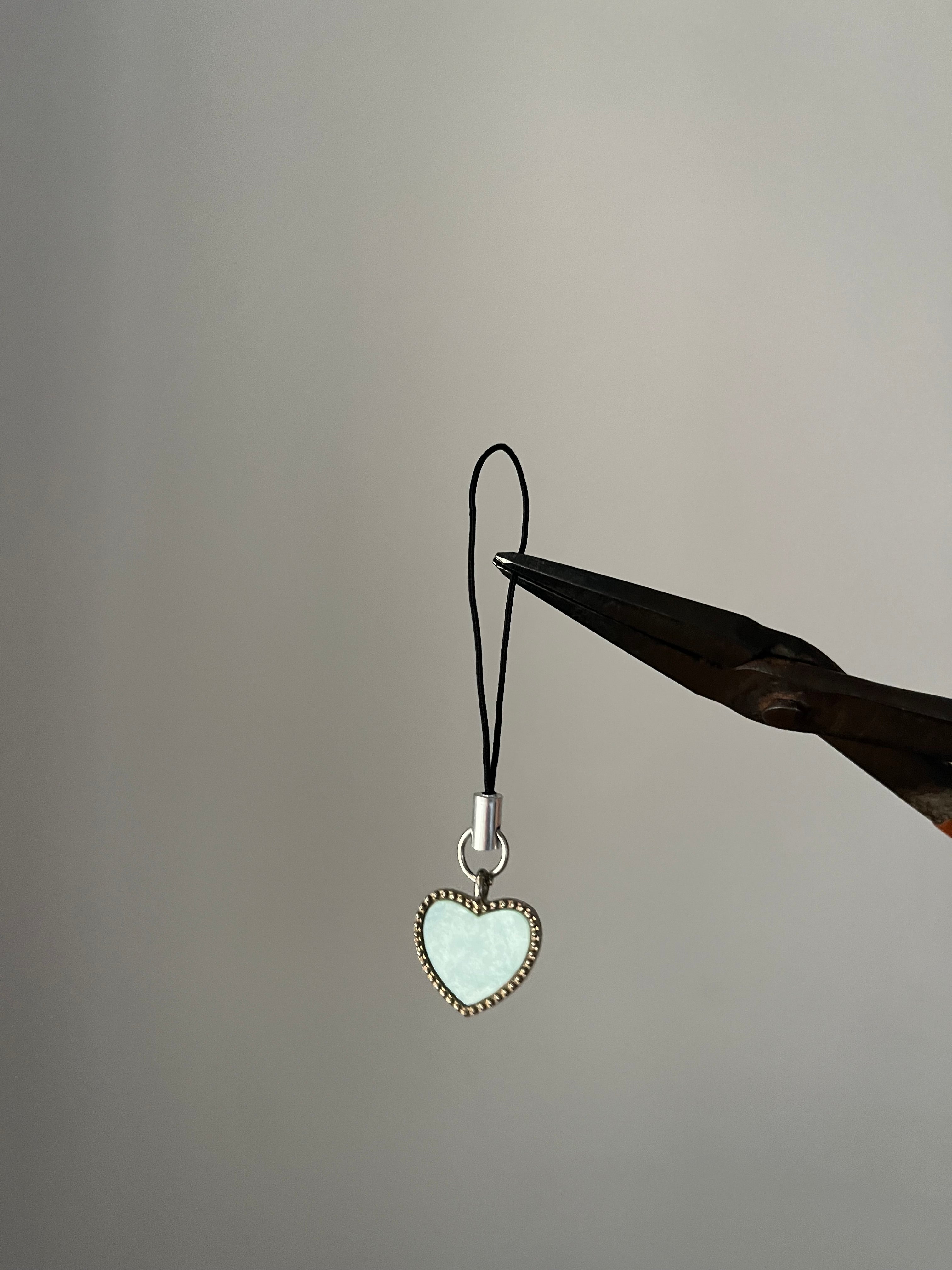 white chrome heart phone hanging