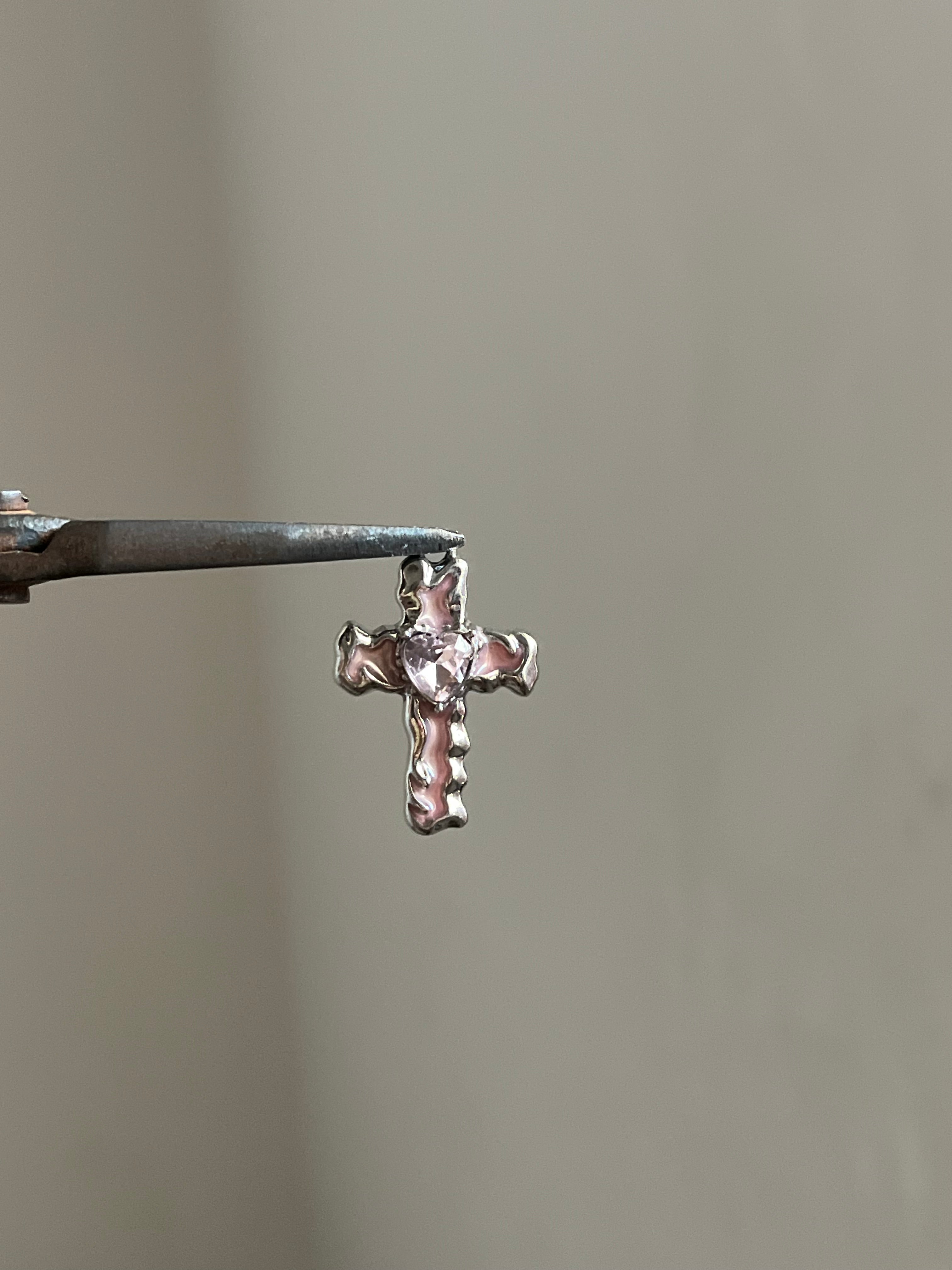 pink lumi cross charm