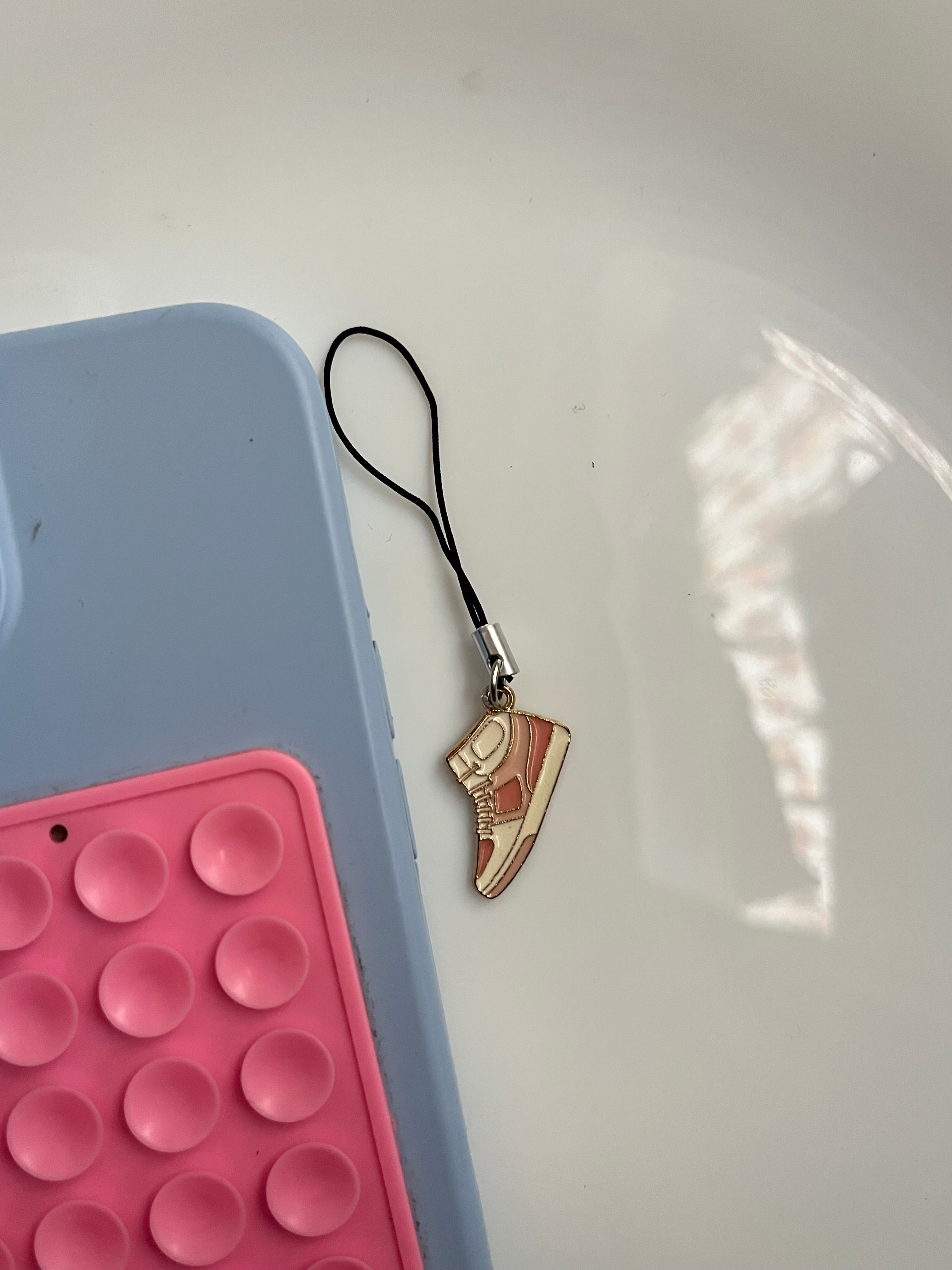 pink sneaker phone hanging