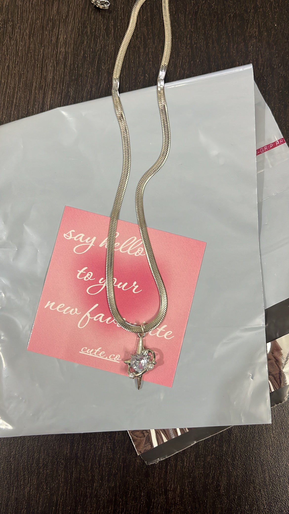 saturn star with flat snake chain