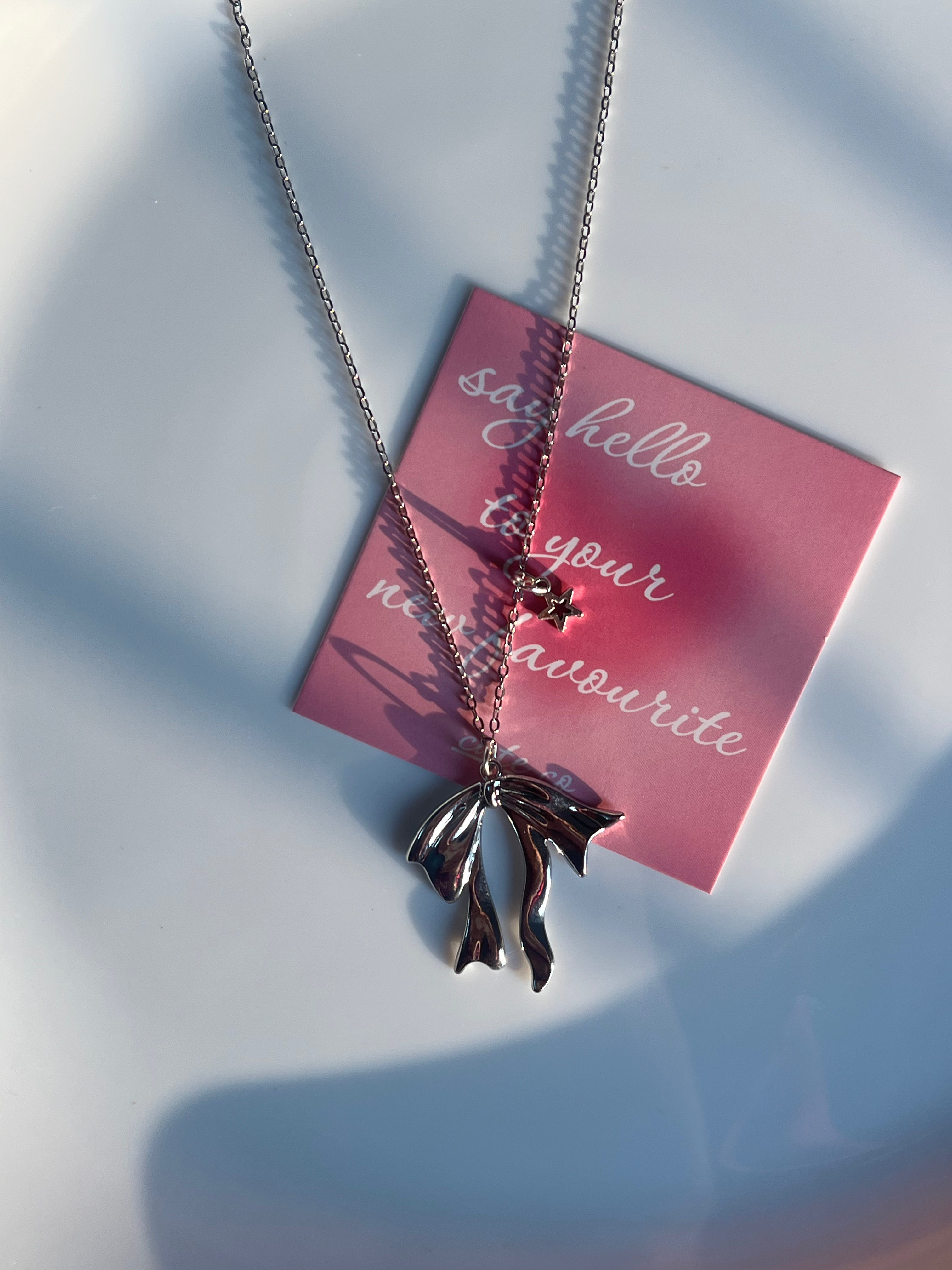 fallen bow with mini star chain