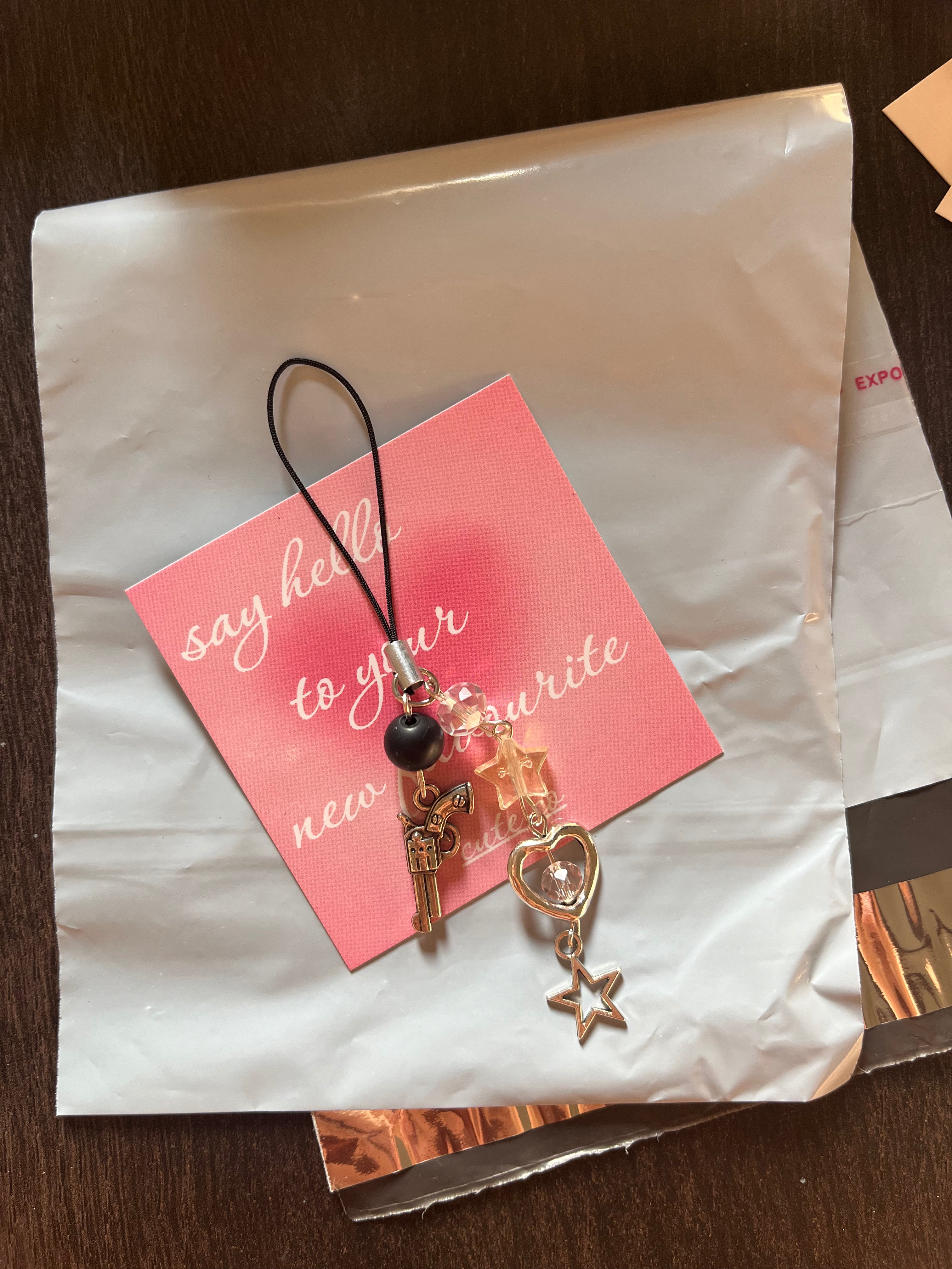 gun phone charm