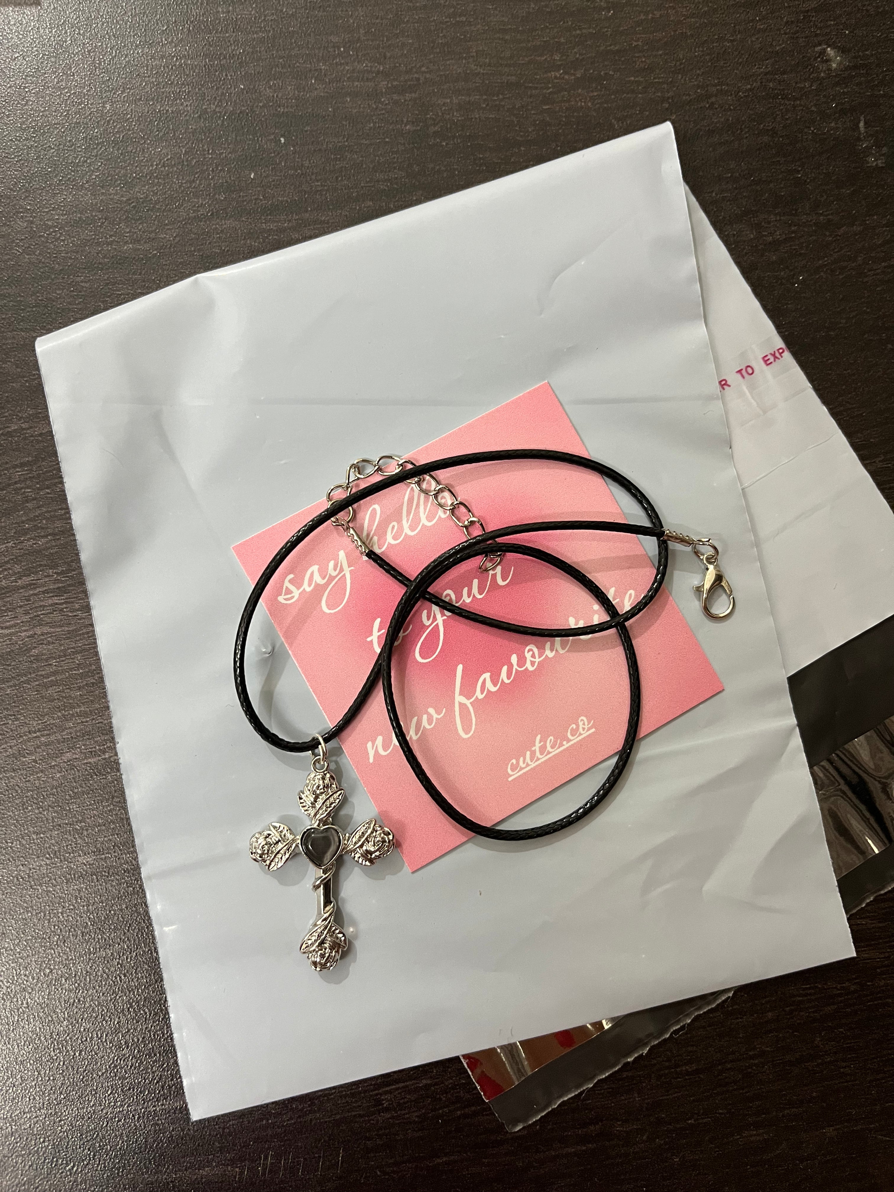might black cross cord chain
